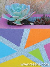 Paint concrete blocks to make colourfull planters