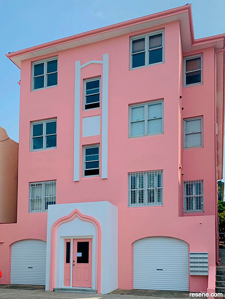 A transformed pink apartment exterior